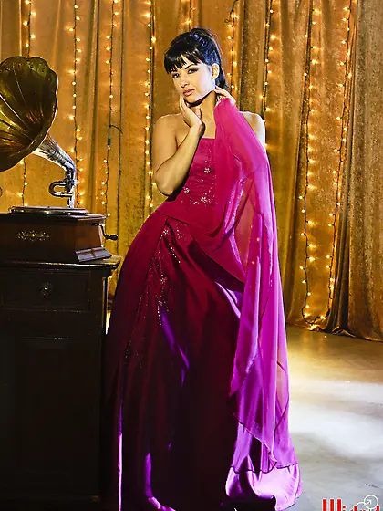 Carmen Hart posing in her purple dress,  getting naked and showin