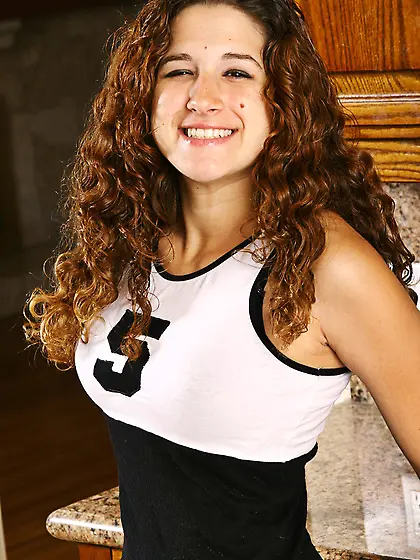 Curly haired Elise Eighteenth strips to show her juicy natural t