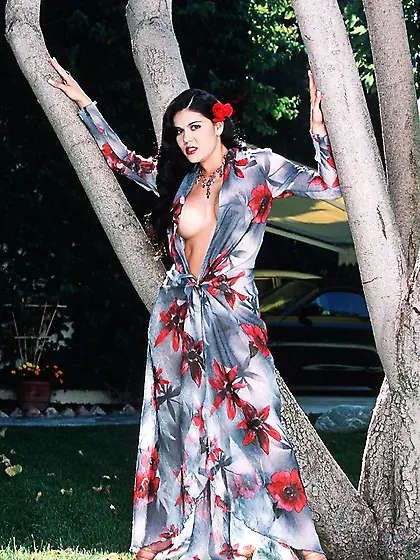 Horny Latina babe Olivia strips her gown showing tits and dildo