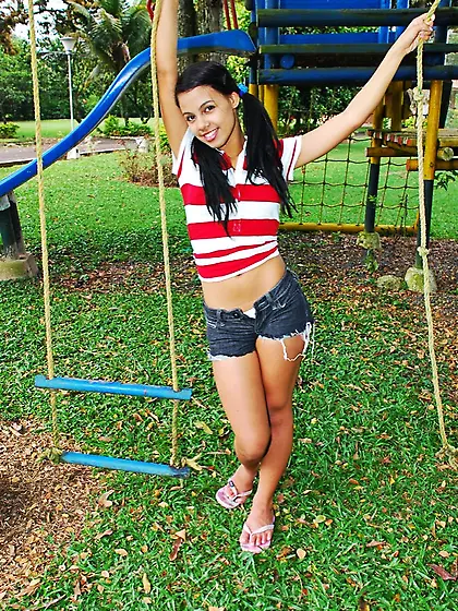 Tanned busty brunette Gigi Spice taking texas shorts off and fin