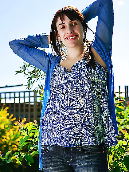 Redheaded babe bends over to showcase her firm booty for you