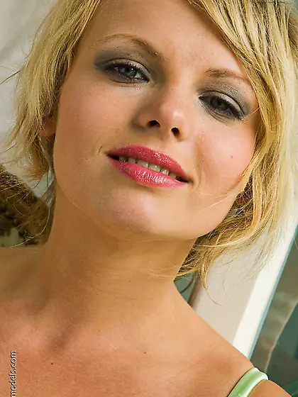 European blonde Blackberry Brittany in green corset exposes her