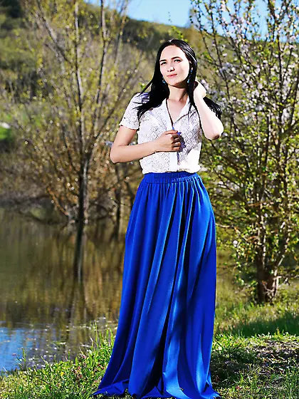 Pale-skinned brunette takes off her long,  LONG skirt to show her