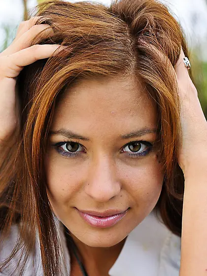 Sultry brunette Irina J is fooling around in the meadow showing