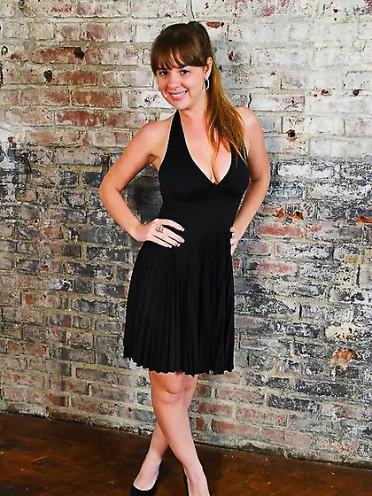 Sweet candy undresses and playfully flaunts her round tits with