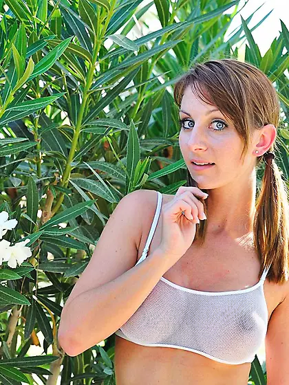 Busty brunette Leann FTV takes off her tiny clothes to make some