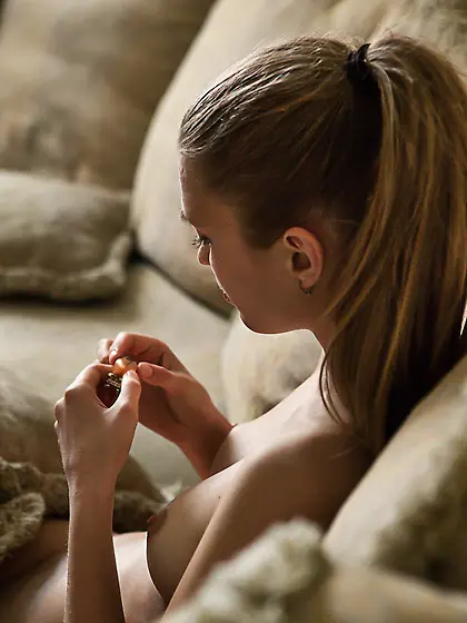 Ponytailed blonde with blue eyes playfully seducing the viewer V