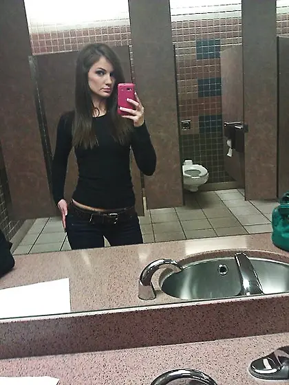 Beautiful skinny babe takes photos revealing pink pussy and smal