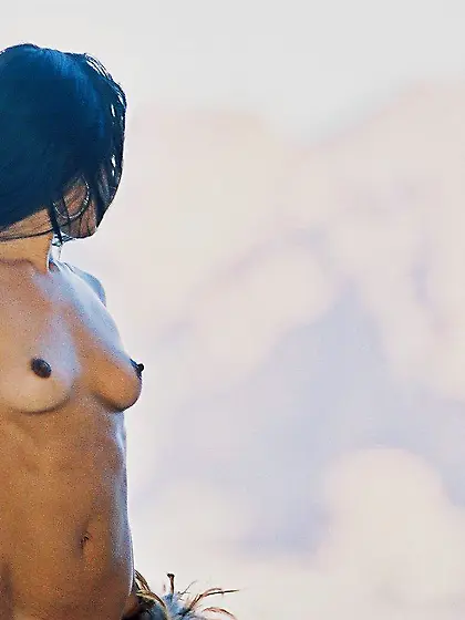 Dark-haired Latina exposes her slightly hairy pussy while on the