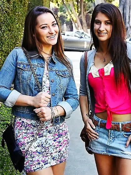 Dani Daniels and Karina White strip together on the bed and have