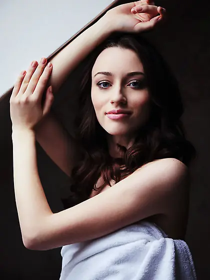 Gorgeous blue-eyed brunette enjoys