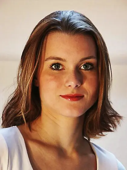 Young European office girl strips and touches her peach at worki