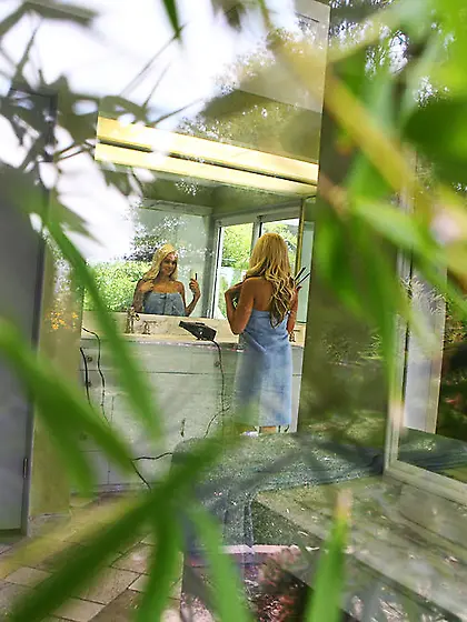 Sneaky voyeur films a blonde babe taking her clothes off before