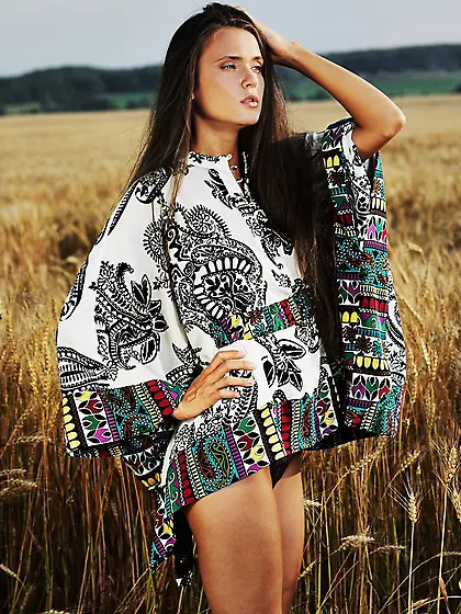 Anastasia Petrova takes her clothes off outdoors on the field an