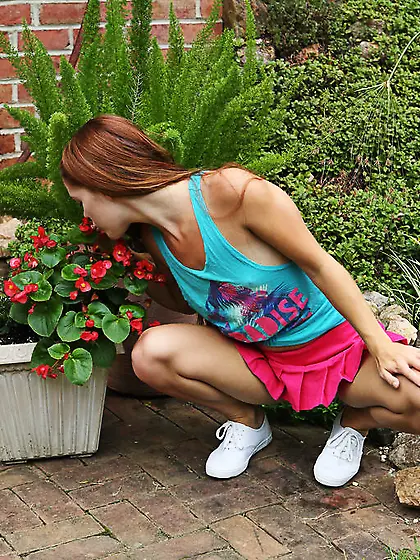 Hungry girl masturbates with a water hose and small rakes in the