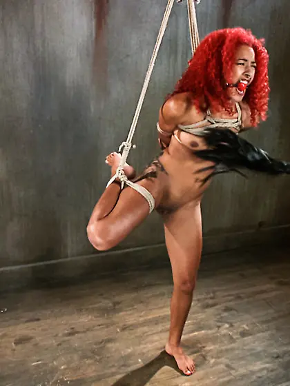 Pretty redhead roped bound