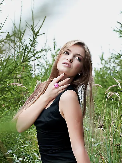 Appealing blonde in black heels and dress shows us her gorgeous