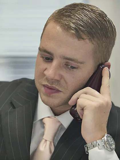 Glasses-wearing brunette in stockings gets licked and dicked by