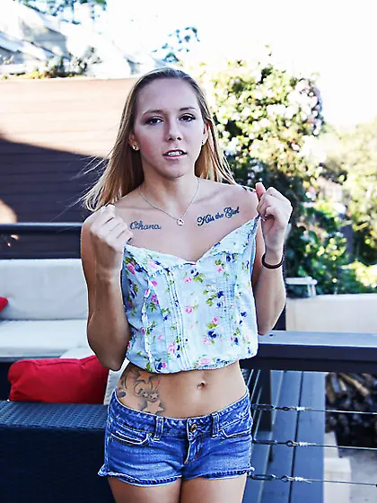 Tattooed blonde brown eyes