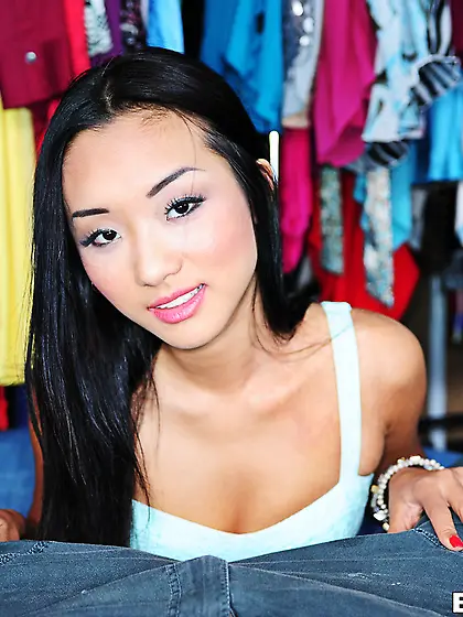 Asian brunette teen sucking this meaty cock in a dressing room