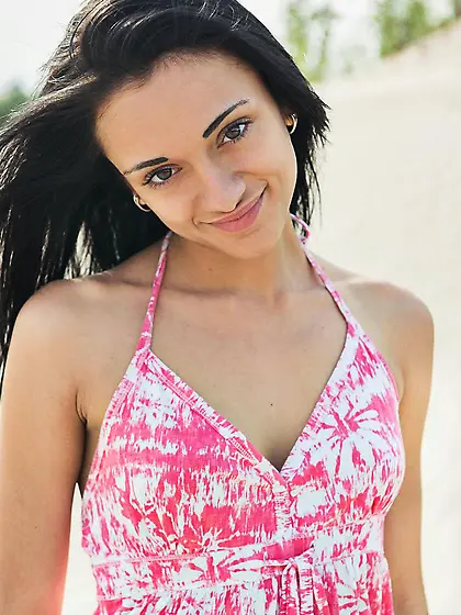 Luscious teenie Aprilia B is on the beach showing shaved cunt in