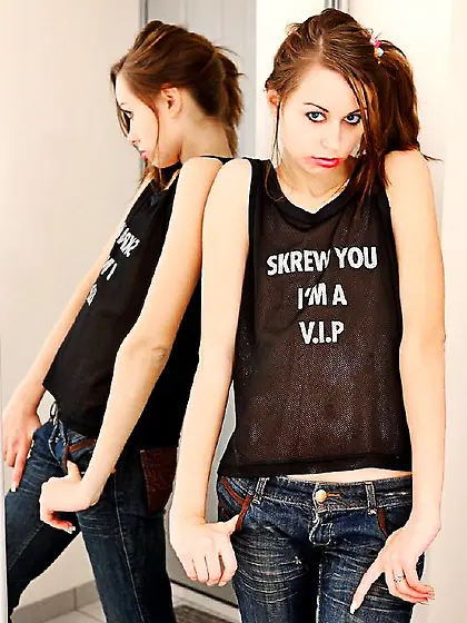 Horny teen Nastia YLP is losing off top and jeans showing flat b