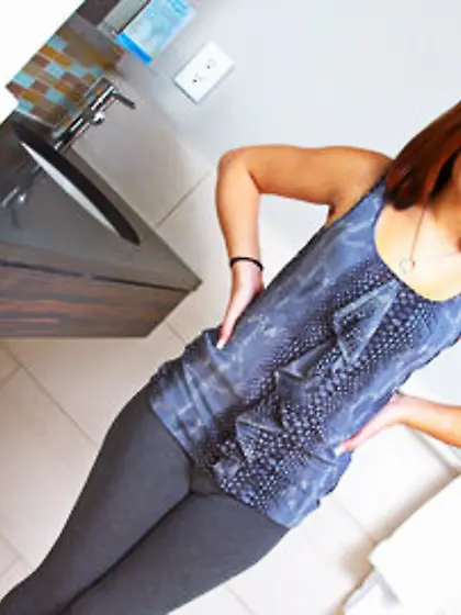 Red-haired cutie takes off yoga pants and poses with her tiny ti