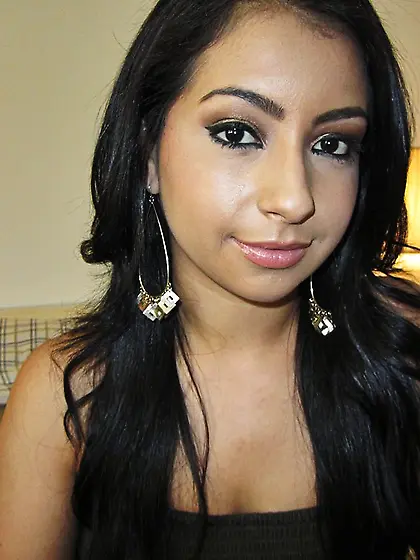 Busty lady having dark hair is sucking her lover's penis an