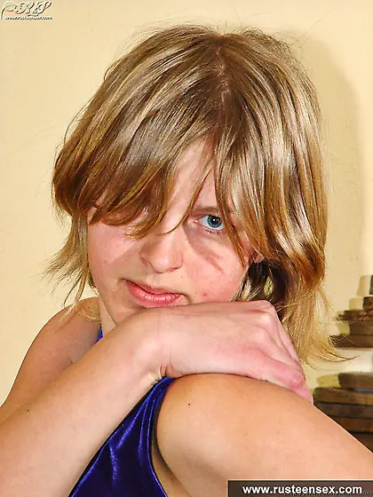 Russian teen blonde masturbates with orange dildo