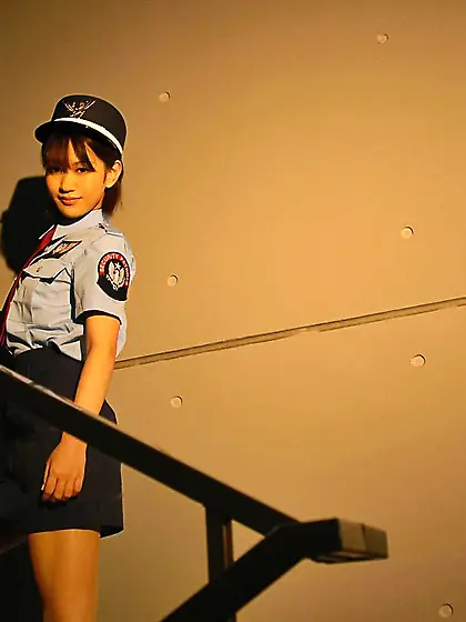 Asian police woman Riina Idols is showing off in her uniform and