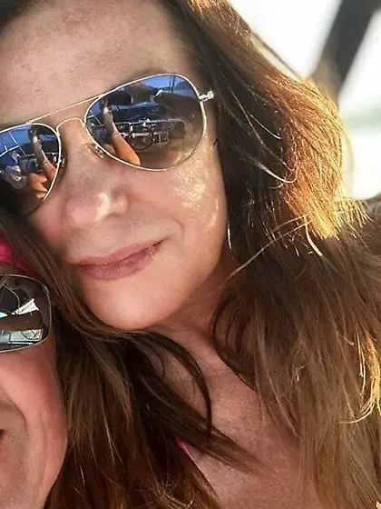 Rhonda roots for her team with her tits out