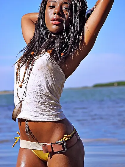 Ebony beauty showcasing her fantastic body on the beach