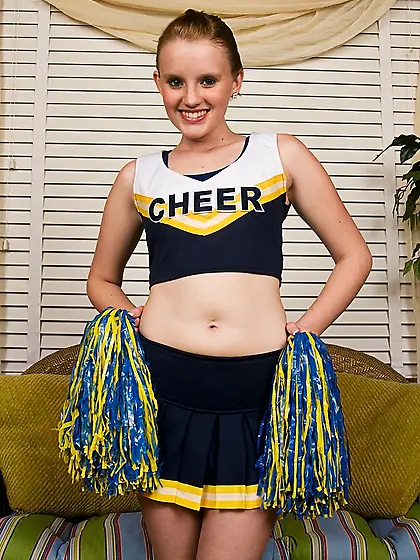 Petite smiling cheerleader Katey Grind gets totally nude and dis