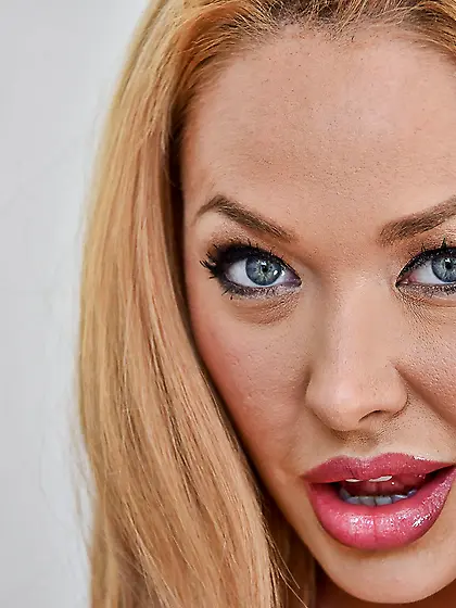 Smoldering blonde with killer curves is about to take off her on