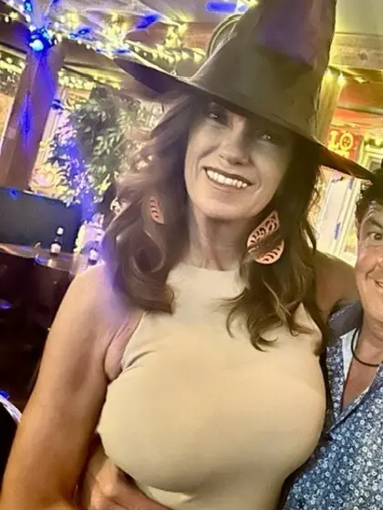 Rhonda roots for her team with her tits out