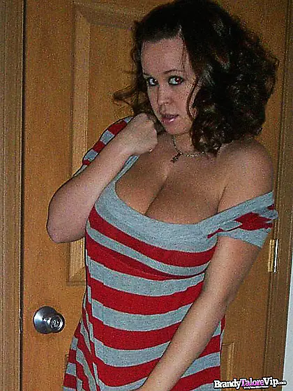 Big breasted blonde slut Brandy Taylor strips and shows us her p