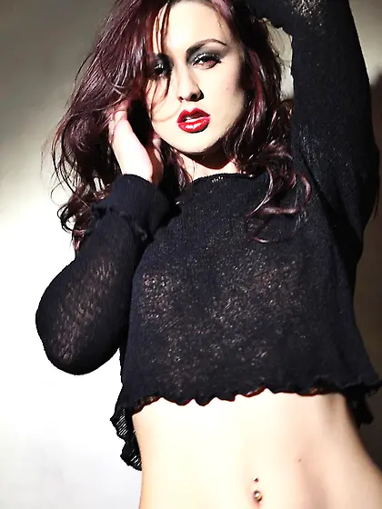 Hot softcore redhead Karlie Montana strips to pose in black pant