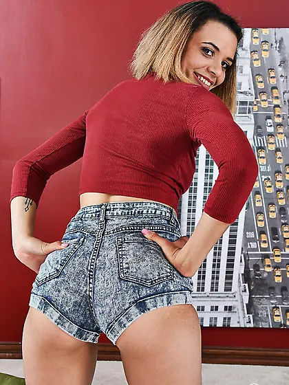 Tall babe has sweet panties under the shorts and flashes them as