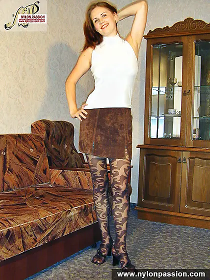 Pantyhosed teen girl shows nyloned legs