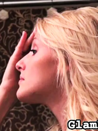 Blonde dolls perfect their makeup in the...