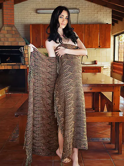 Long-haired brunette with blue eyes gradually removing her long