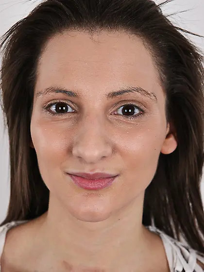 Young woman with cunning smile leaves nothing on sitting on a st