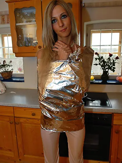 Stunning blonde bares it all in the kitchen.