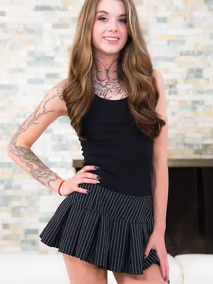 Young woman with tattoos on each body part proves she is hot in