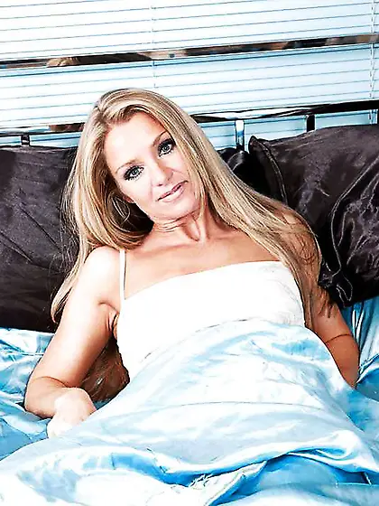 Towheaded Louise Dakotah in sofa