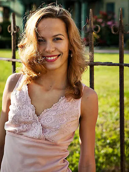 Stunning blonde with a slightly hairy pussy showing off on a sof