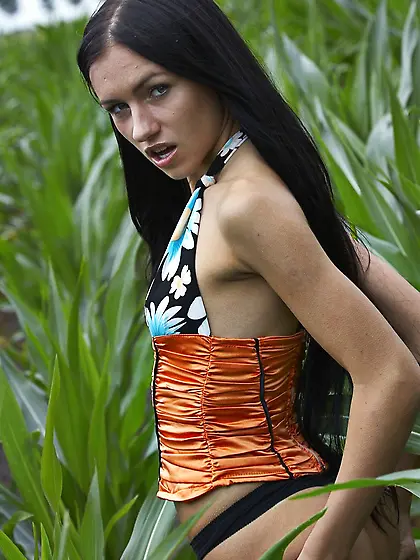 Naughty young brunette shows majestic nude body in the open-air