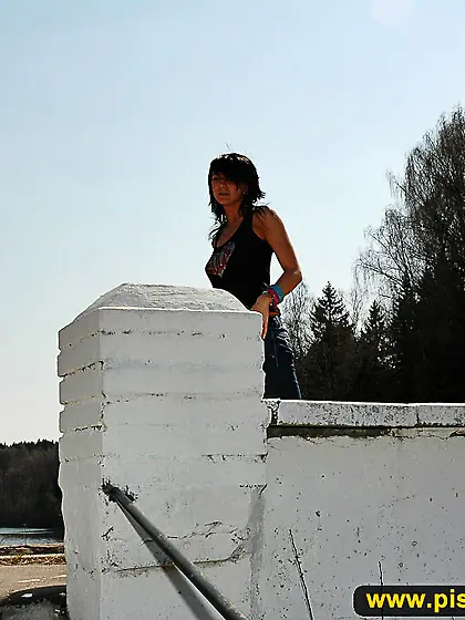 Pissing outdoor on park ladder