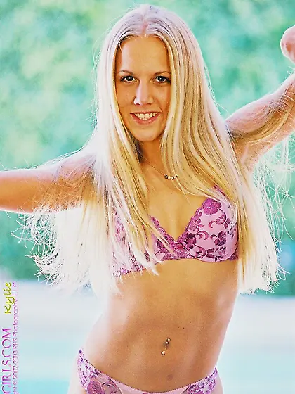 Filthy blonde babe Kylie seductively poses showing her soft nipp