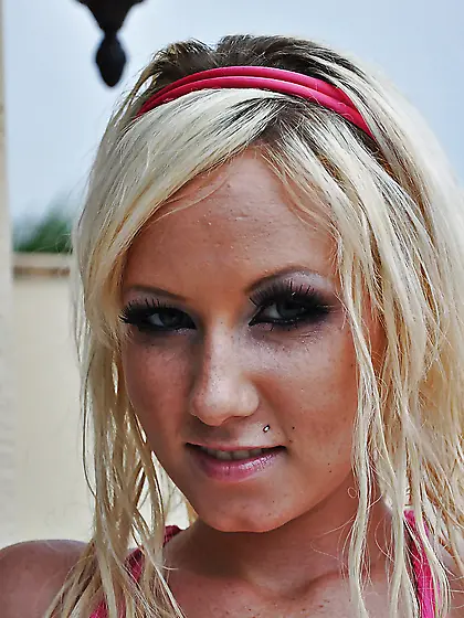 Pretty blonde slowly undresses in living room after fooling arou